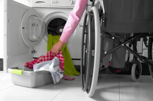 Woman-in-a-Wheelchair-Doing-Laundry-e1661791187311